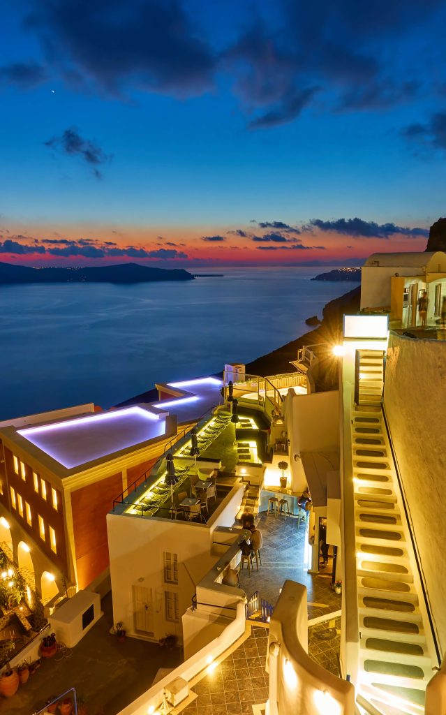 santorini-island-night-greece-view-fira-town-dusk-with-illuminated-open-air-bars~1 (1)