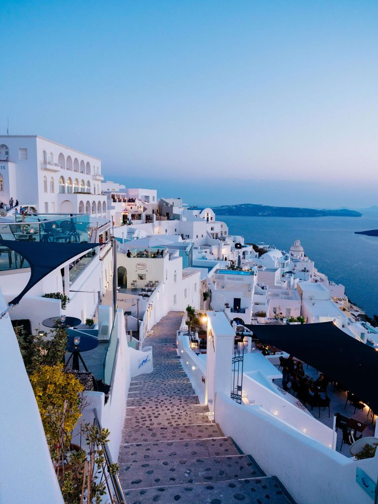 vertical-high-angle-shot-white-buildings-santorini-greece~1 (1)